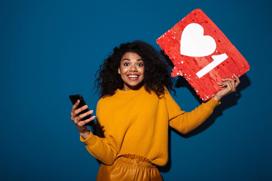 African Woman Holding like Symbol Sign Using Mobile Phone.